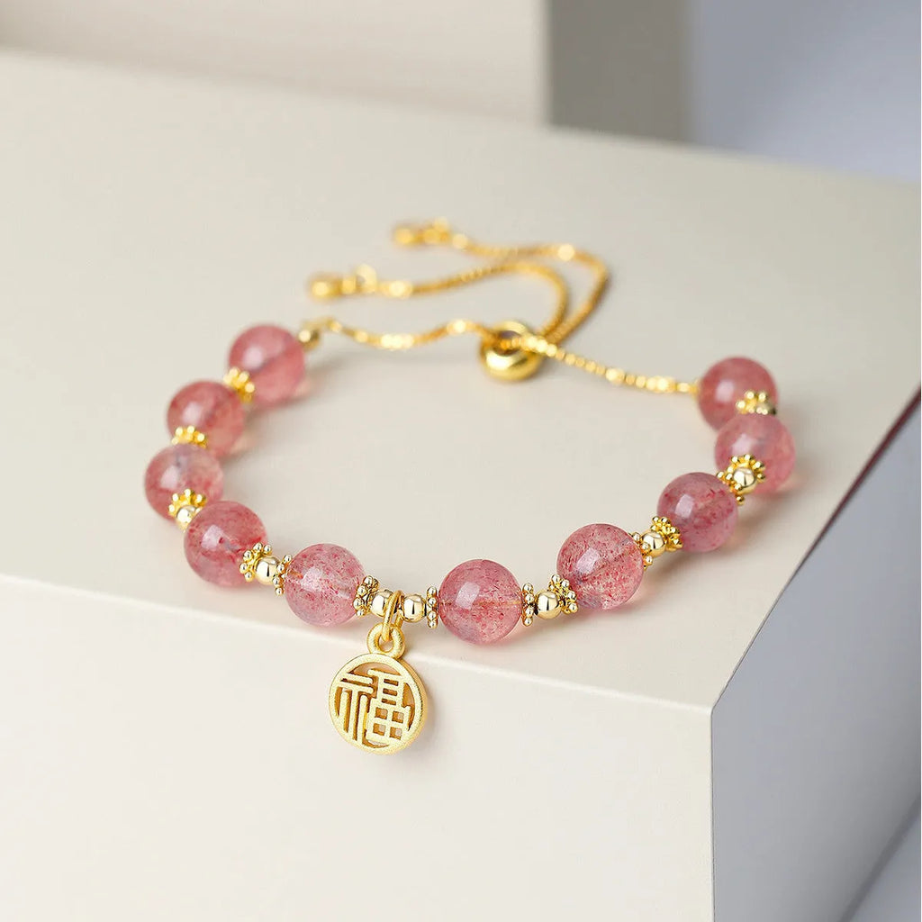 Strawberry quartz electroplated crystal bracelet with geometric fu charm