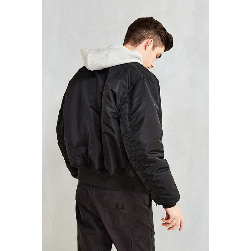Men's loose fit nylon pilot jacket in Army Green shown on a hanger.