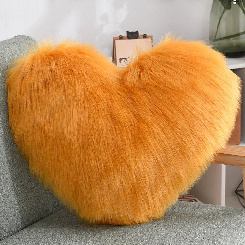 Plush heart-shaped throw pillows in various colors and styles for cozy sofa decor