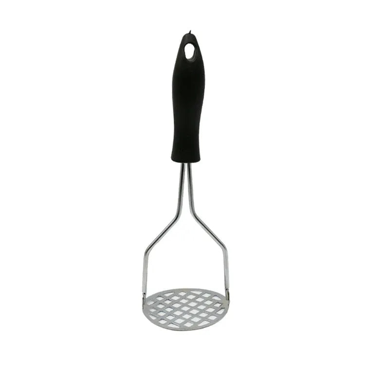 Manual potato masher with wooden handle and flower-shaped iron plated press head on a light surface