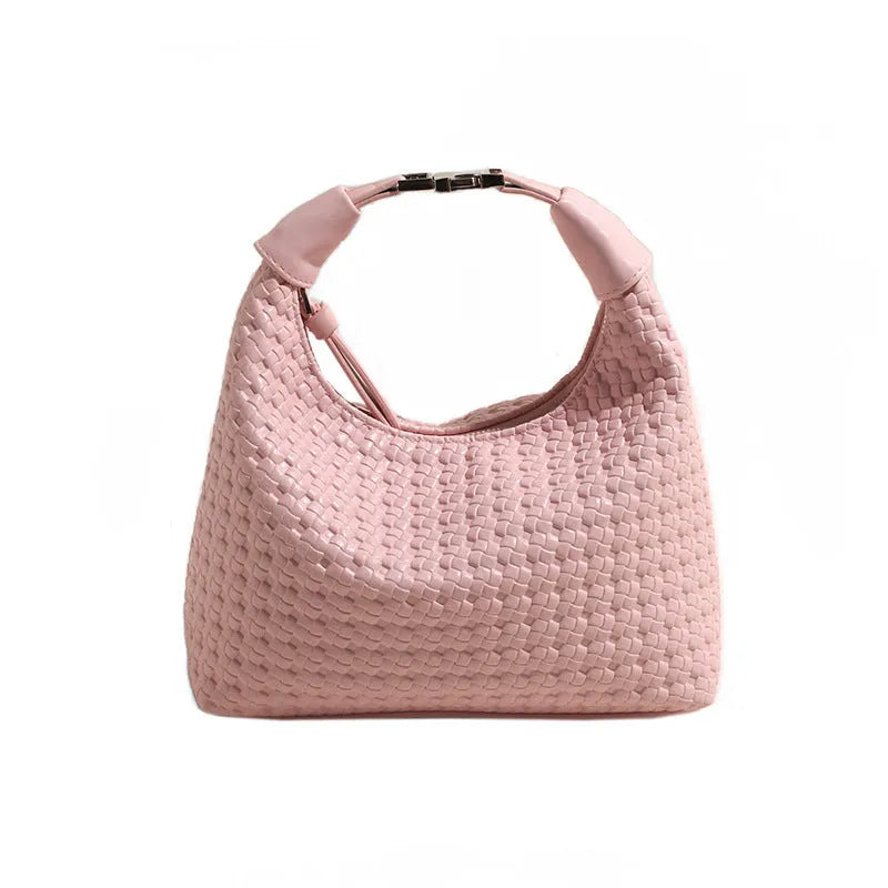 Soft beige PU bucket-shaped messenger bag with an external pocket, shown open to reveal internal document organiser.