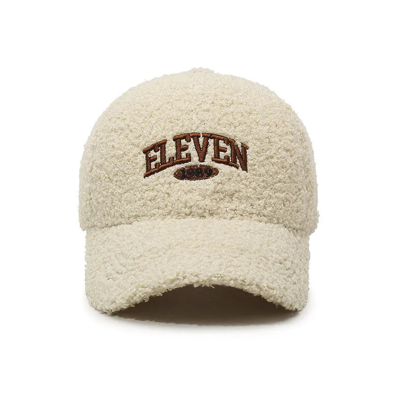 Adjustable lambskin-look winter baseball cap in dome crown style shown in multiple colours.