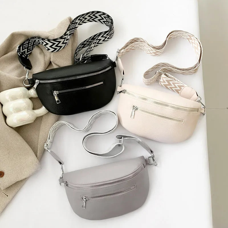 Soft PU crossbody bag in light gray, oval shape, with single shoulder strap and slit pocket
