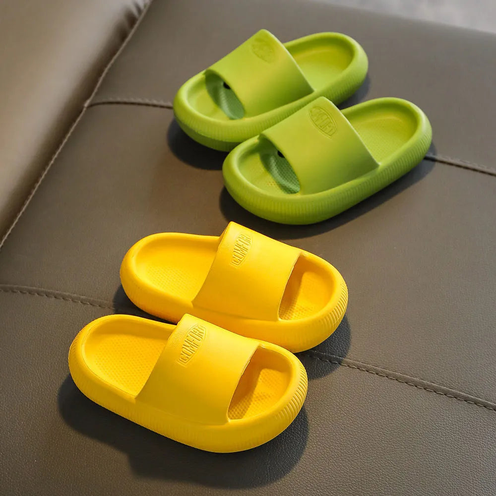 Children's colourful EVA slippers with a non-slip sole, shown in blue, green, orange, pink, and yellow.