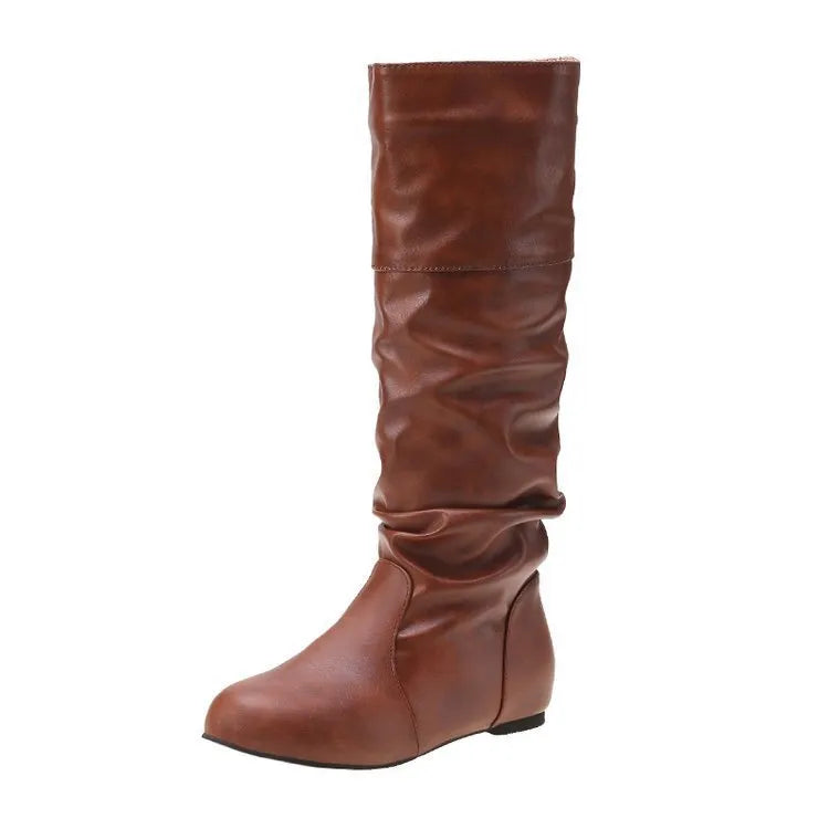Women's black slip-on flat ankle boots with round toe and high calf.