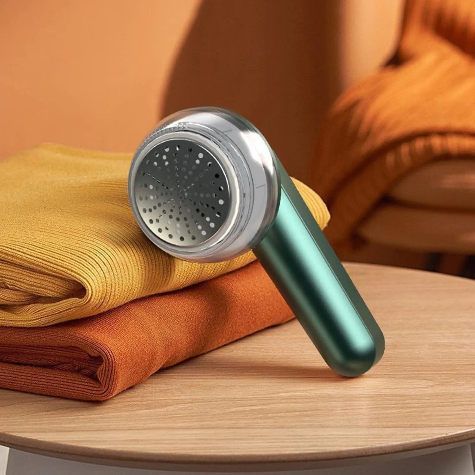 White or green USB rechargeable electric lint remover for clothing with removable lint collector container.