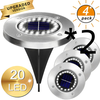 8LED waterproof solar garden light staked in lawn with warm glow, IP65 rated for rain resistance