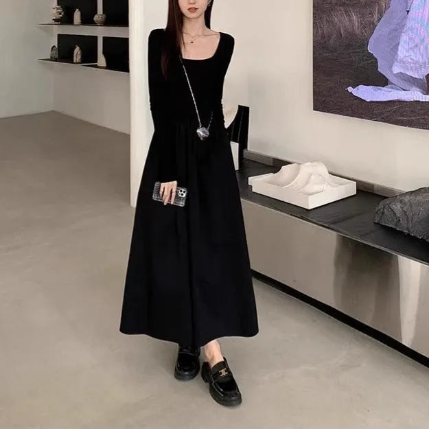 Black knitted square collar dress with long sleeves and an A-line skirt on a mannequin.