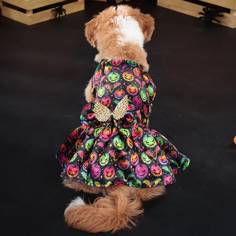 Orange Halloween dog costume with angel wings and a halo, featuring a bright pumpkin print design.