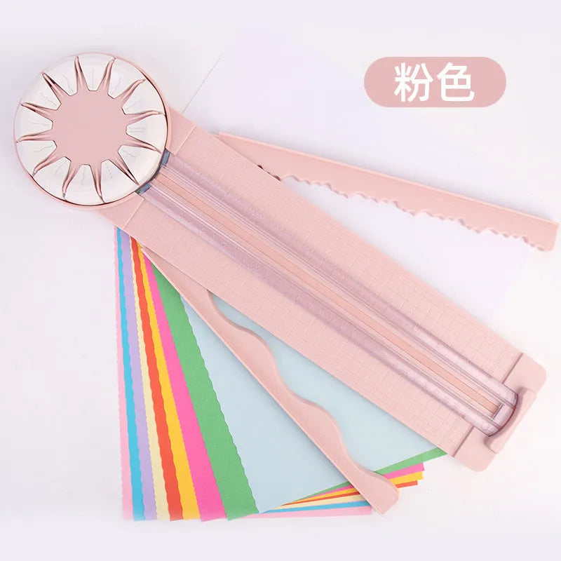 Pink and black 12-in-1 plastic dotted paper cutter on a white background.
