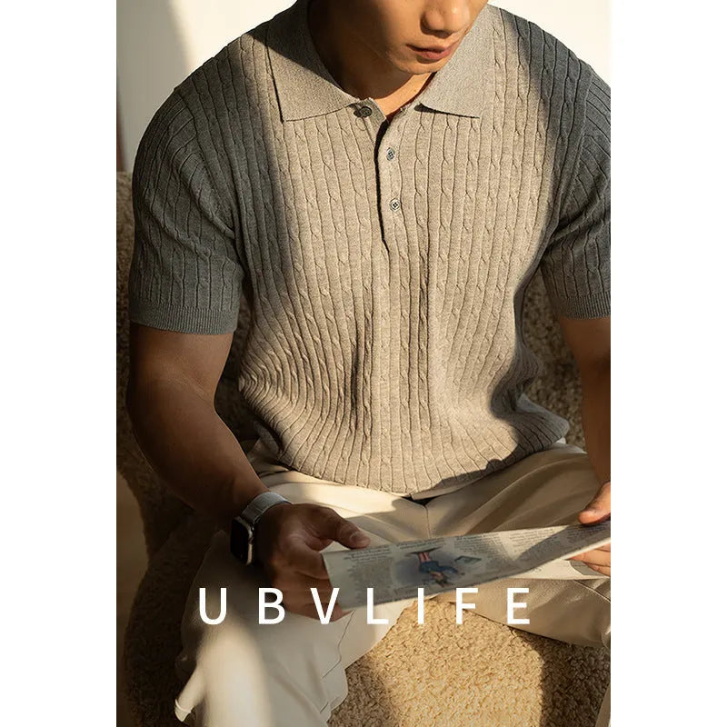 Men's khaki short sleeve business top laid flat, showing collar and sleeve detail.