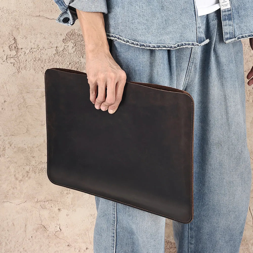 Genuine crazy horse leather horizontal computer liner bag showing medium brown colour and organisational compartments