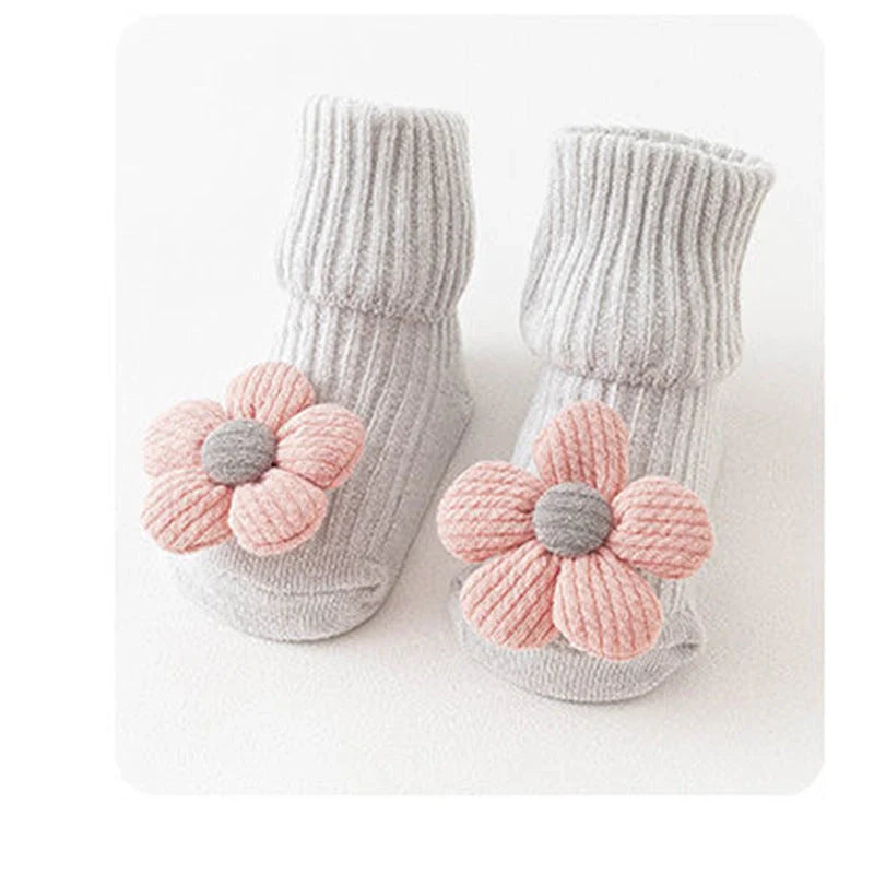 Cotton baby socks in various designs for newborns to 3-month-olds