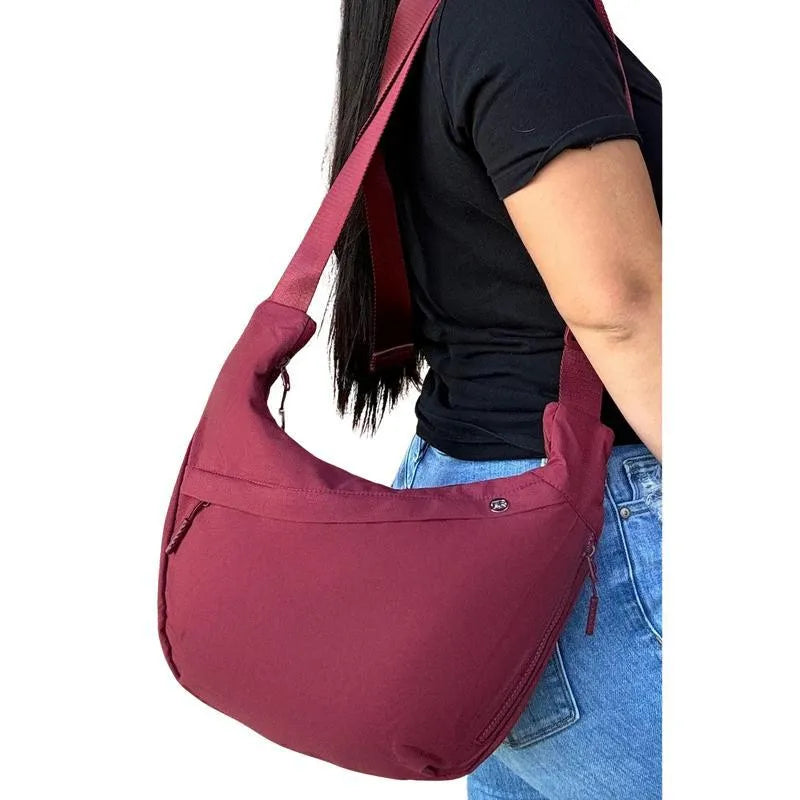 Men's PU canvas shoulder bag with adjustable strap in black, shown on a model for scale