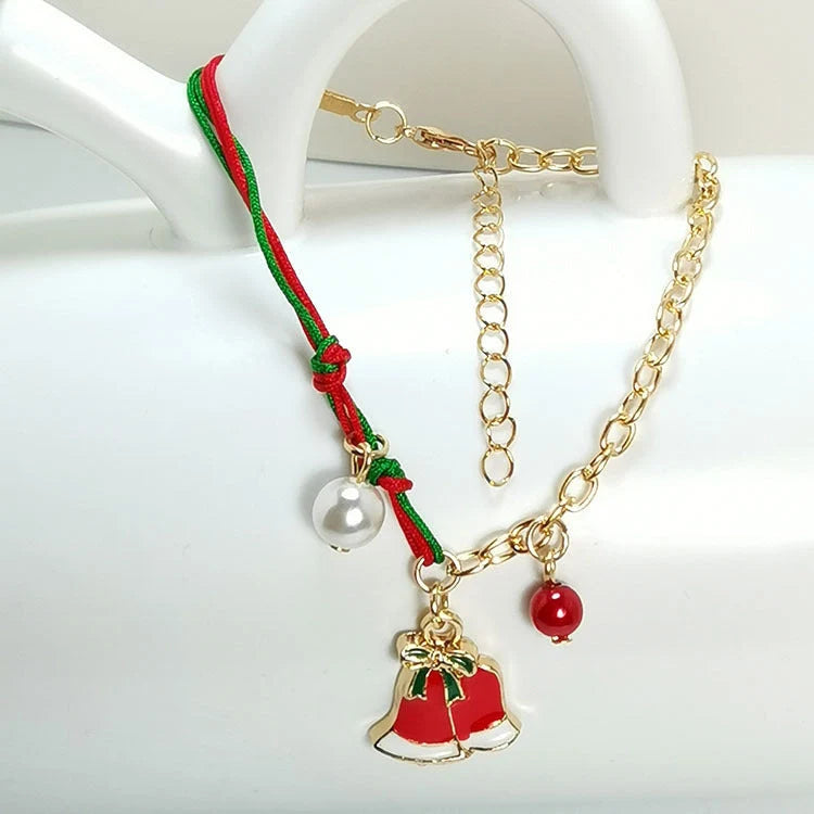 Christmas charm bracelet with snowman, Santa Claus, and snowflake designs
