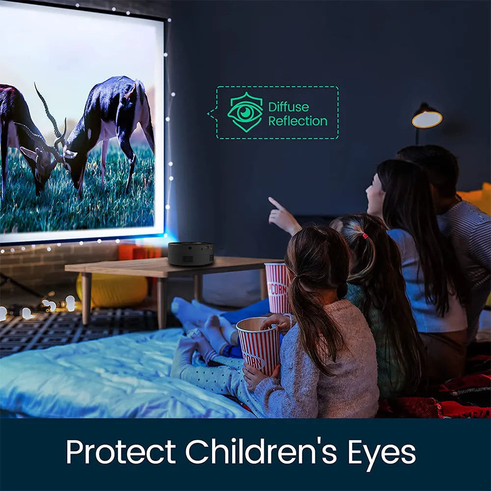 Black mini portable projector for children with phone connectivity on a table.