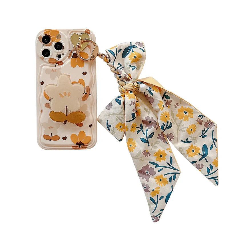 Autumn leaves and flowers with bow silk scarf phone case featuring silicone protection and decorative bracket attachment for iPhone models X through 14 Pro Max