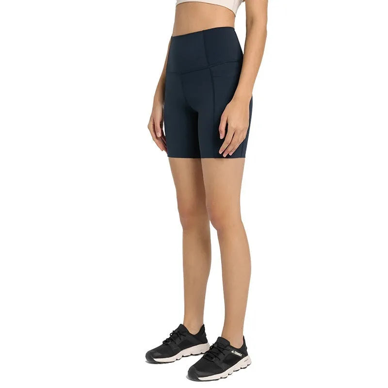 Women's high-waist mid-length sports shorts in black stretch fabric for running and gym