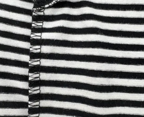 Winter stretch fleece vest for pets in green stripes on a small dog