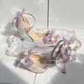 Purple satin women's wedding pumps with a flat heel and square toe.