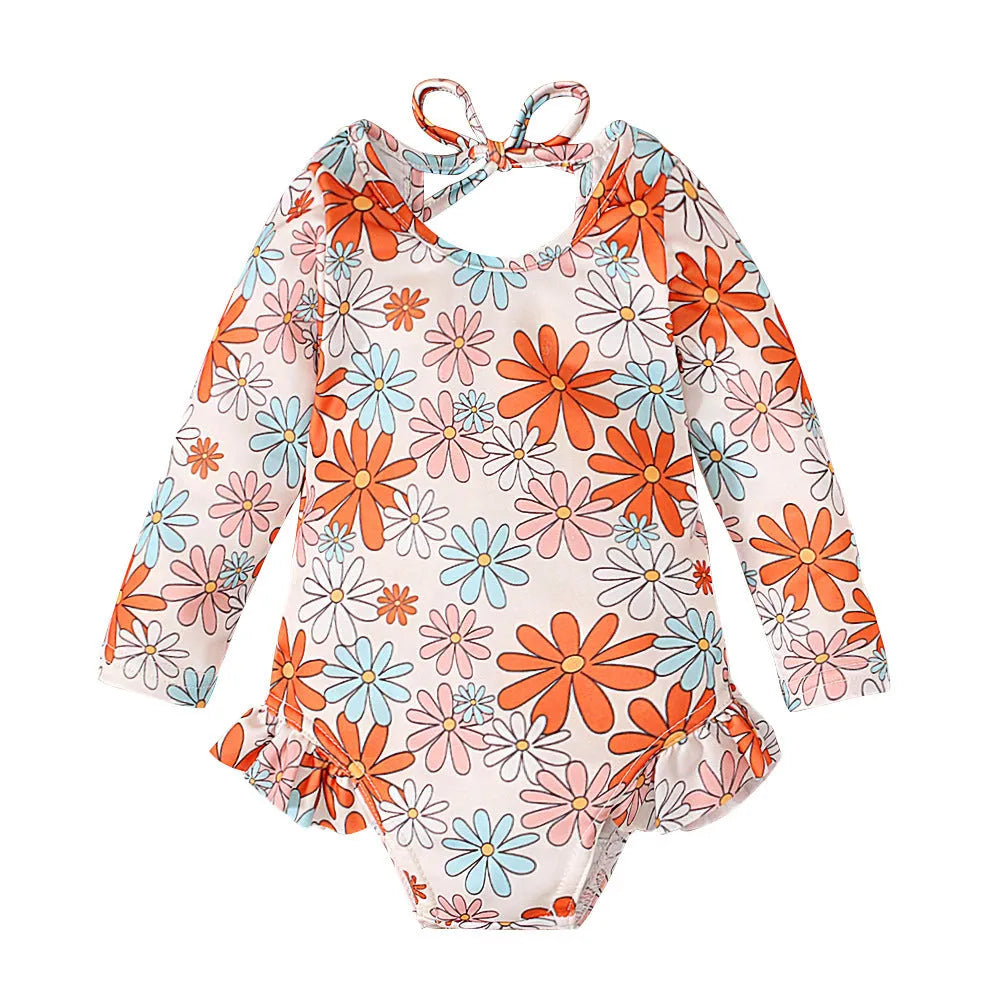 Girl's floral print swimsuit with crew neckline and open back design in orange colour
