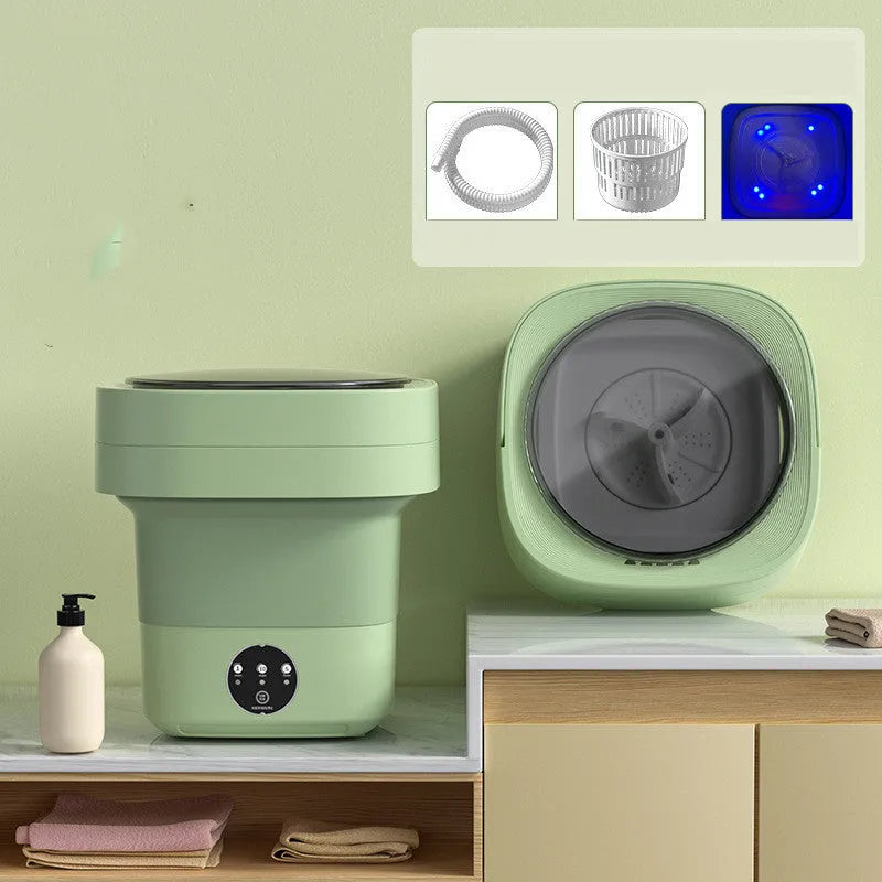 Green foldable mini portable washing machine with drain pipe and basket on a white background.