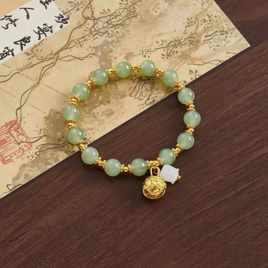 Coloured glaze Chinese bracelet with mixed materials in leaf, drop, and star shapes