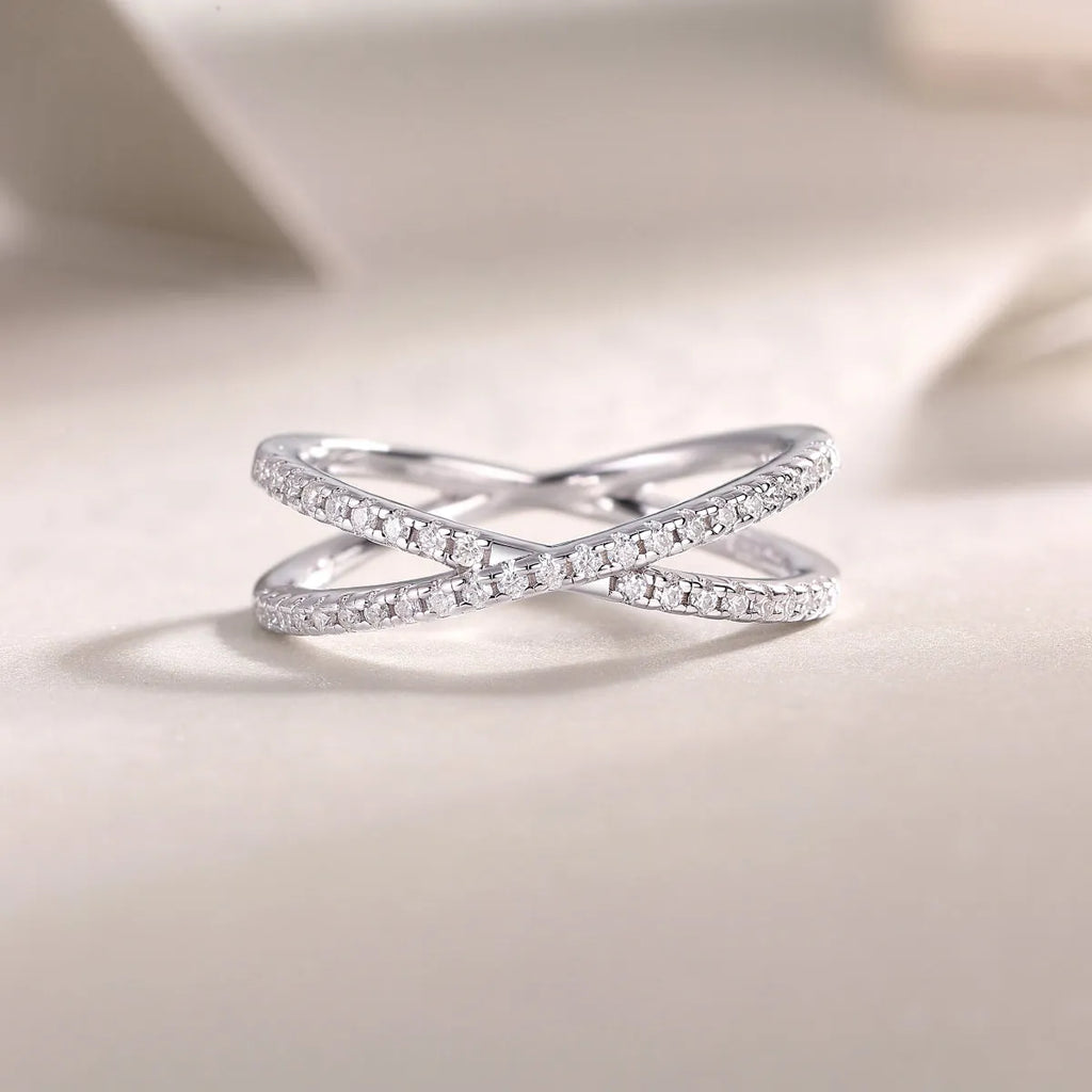 Love Interwoven moissanite wedding ring set in gold finish, S925 silver platinum plated, on white background with gift box.