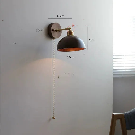 Nordic style wooden wall mounted bedside lamp in a bedroom setting