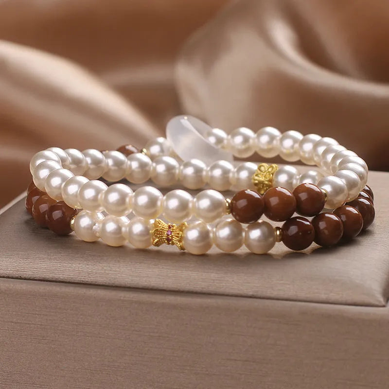 Natural white freshwater pearl and crystal double circle cook stitching flexible bracelet on woman's wrist, 34cm circumference