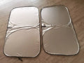 Titanium silver aluminium foil car sunshade laid flat showing its rectangular shape and size.