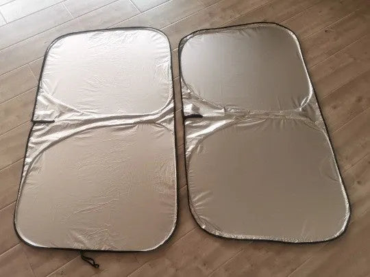 Titanium silver aluminium foil car sunshade laid flat showing its rectangular shape and size.