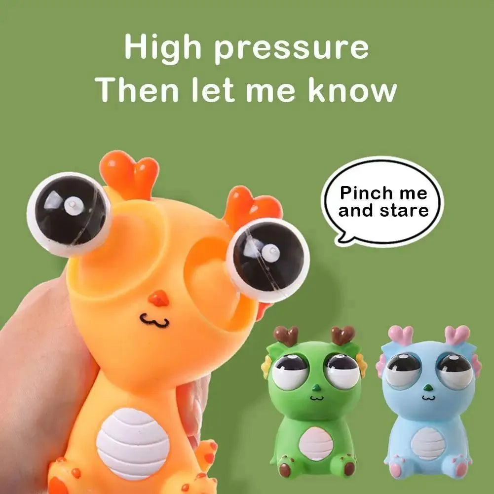 Cute staring dragon eyeball burst squeeze toy in orange colour on white background