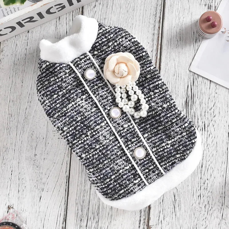 Black PU cat sausage jacket costume for dogs on hanger showing size range