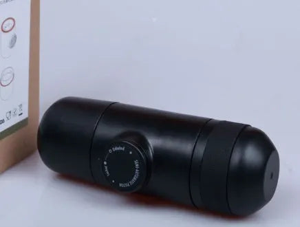 Black portable manual espresso maker showing compact 17.5cm height and 6cm diameter.