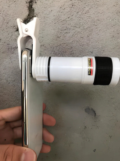 Clip-on 12x zoom telescope lens attached to Galaxy S7 phone, showing retractable design and universal clip, 80x30mm size