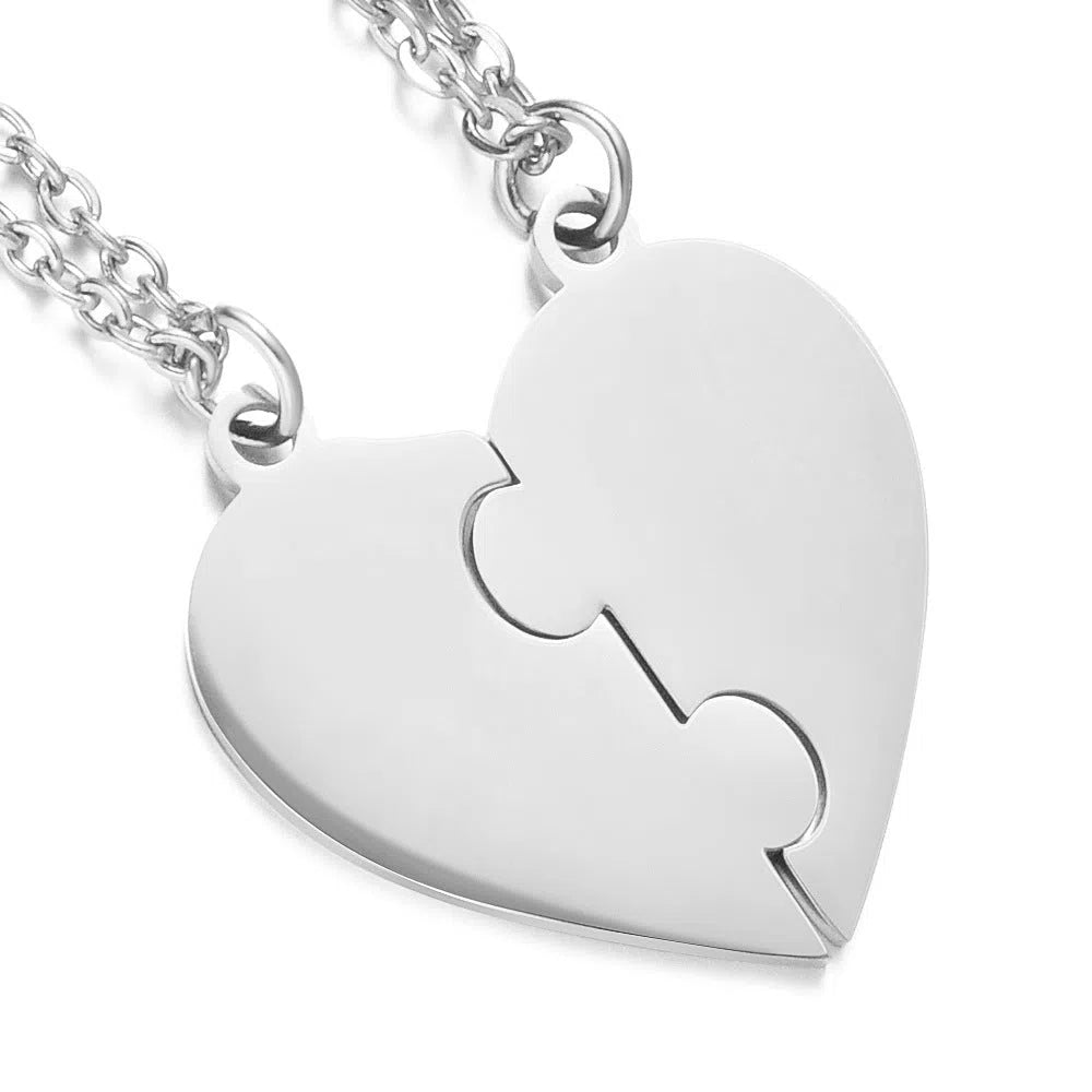 Stainless steel heart-shaped combination pendant necklace in gold finish on white background