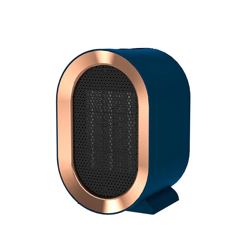 Mini Portable PTC Ceramic Heater on a desktop, showcasing its compact design and efficient heating.