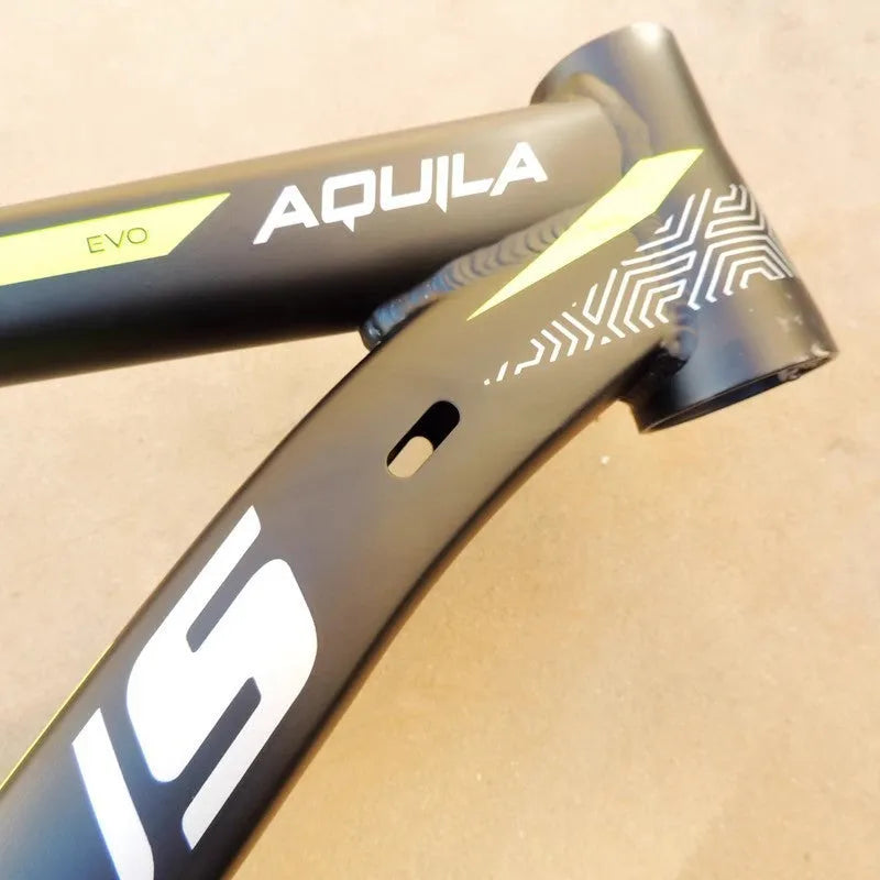 Black green 29 inch aluminium mountain bike frame showing internal cable routing ports and disc brake mount.