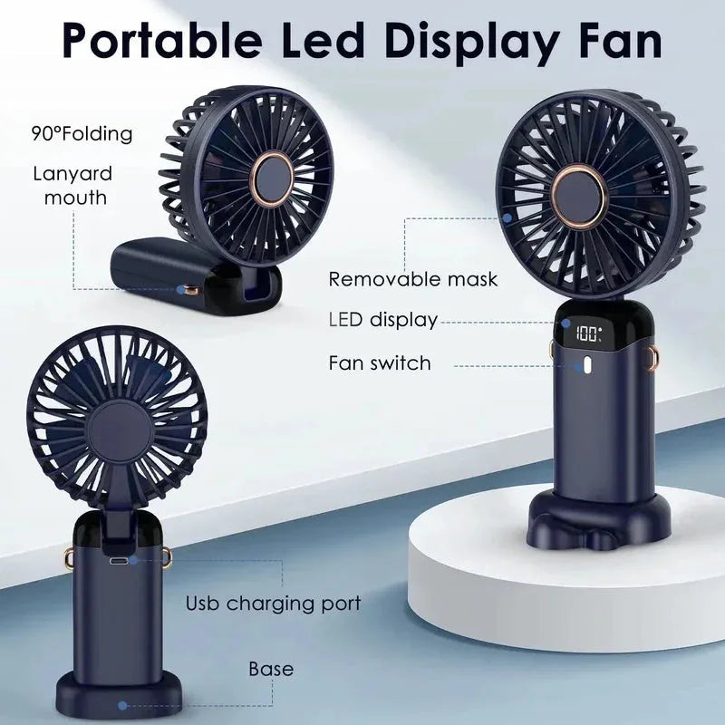 Blue portable electric fan folded at 190-degree angle showing handheld grip, desk base, and neck lanyard attachment
