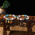 Handmade glass bracelet with swallowing gold beast design and 10mm heart-shaped beads in fluorescent glaze