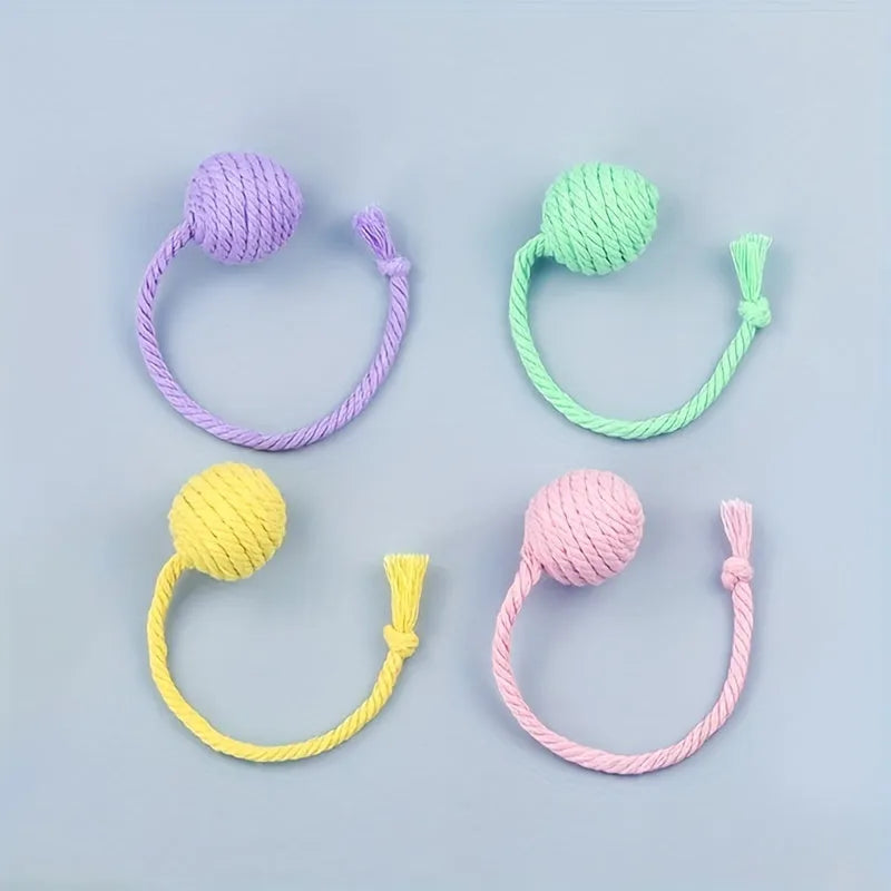 Coloured cat toy ball with rope handle and internal bell in 6cm or 3cm sizes