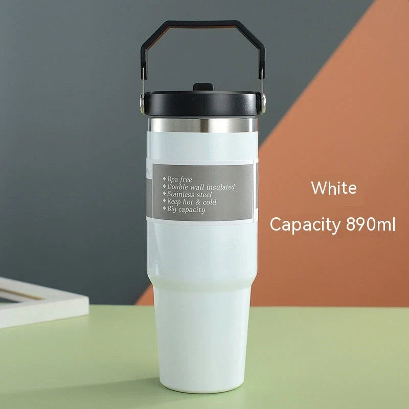 Insulated stainless steel travel tumbler with double-wall vacuum technology, sweat-proof powder coating, and BPA-free sliding lid for hot and cold drinks on the go.