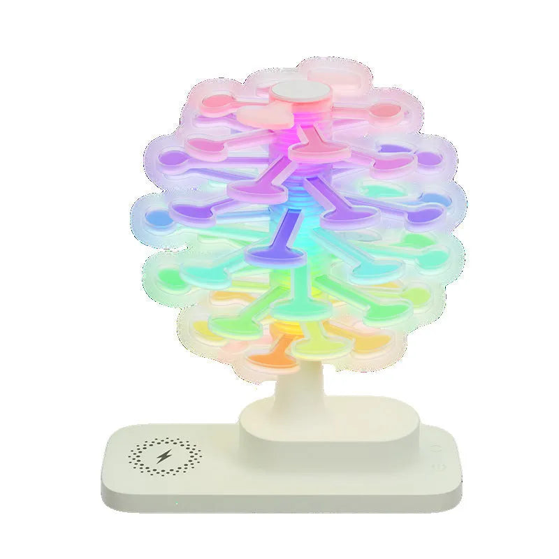 Spiral Tree geometric modern LED desk lamp with white light on a wooden surface.