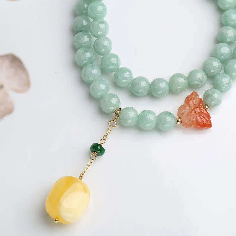Double-layer women's bracelet with emerald jade round beads and beeswax barrel beads in geometric design