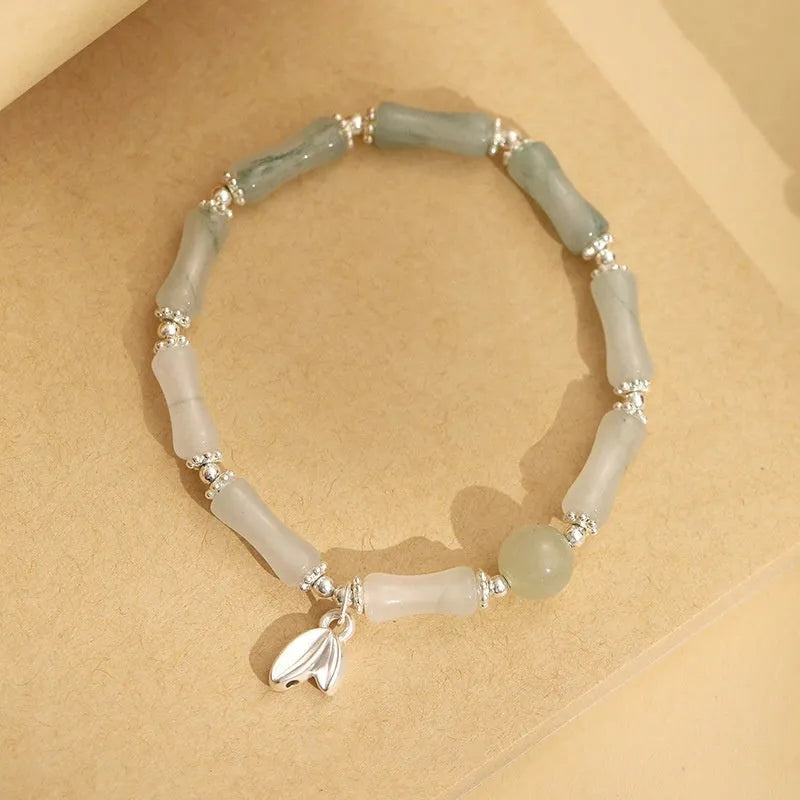 Women's antique-style bracelet made from Tianshan green bamboo and sterling silver with bamboo joint detailing.