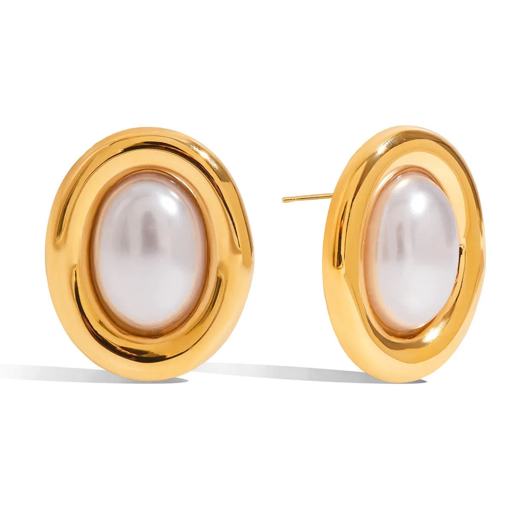 A pair of stainless steel vintage pearl ball stud earrings with surgical steel posts on a white background.