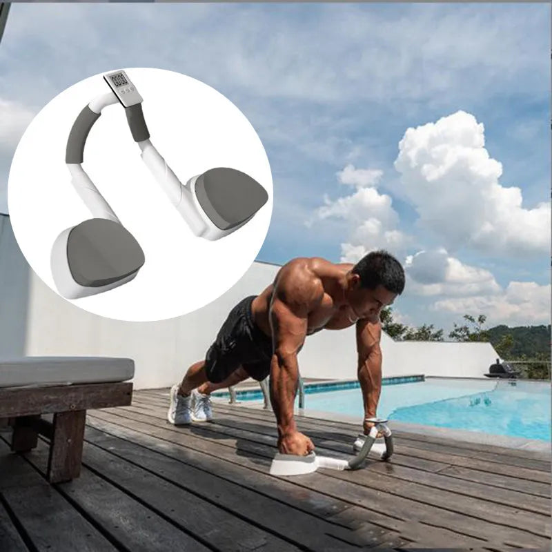 Grey push up fitness board with flat support trainer and LCD display on a floor