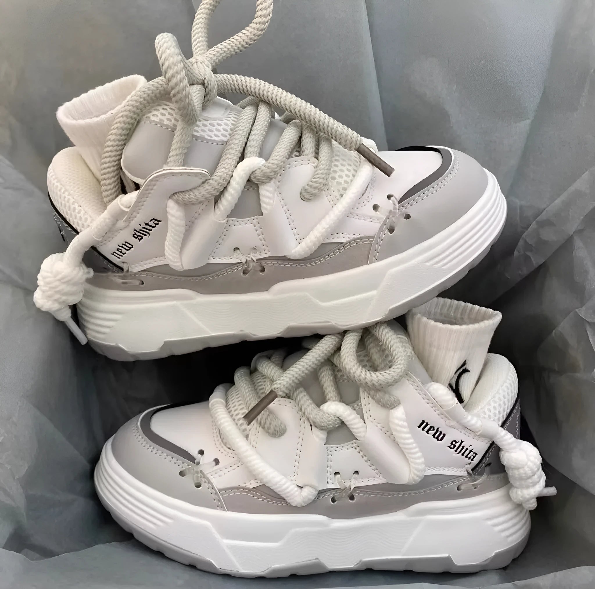 Women's grey retro chunky platform sneakers with thick rubber sole and front lacing