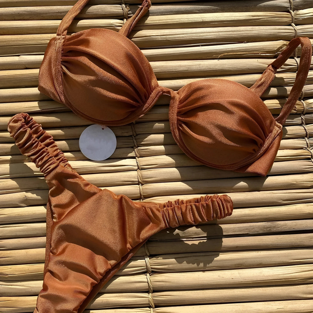 Women's black underwire bikini top and briefs set made from high elasticity nylon fabric.